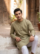 Man in olive green kurta with white shalwar – Riwayat men's ethnic wear